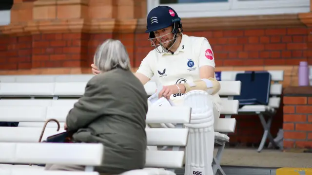 Tom Helm chats to a spectator at Lord's