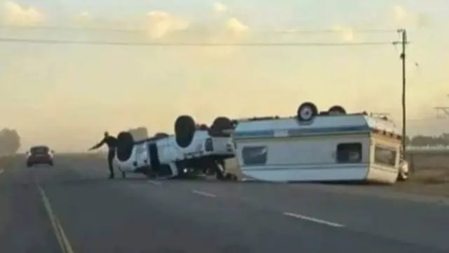 An image showing vehicles flipped down by strong winds in South Africa's Cape province on 7 April 2024