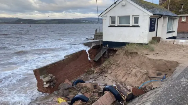 The coastwatch station that has partly collapsed into the sea following the storm