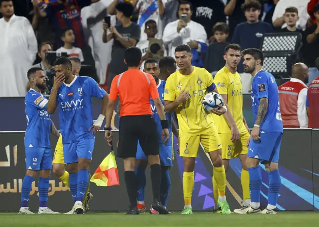 Cristiano Ronaldo reacts to the referee after been given a red card