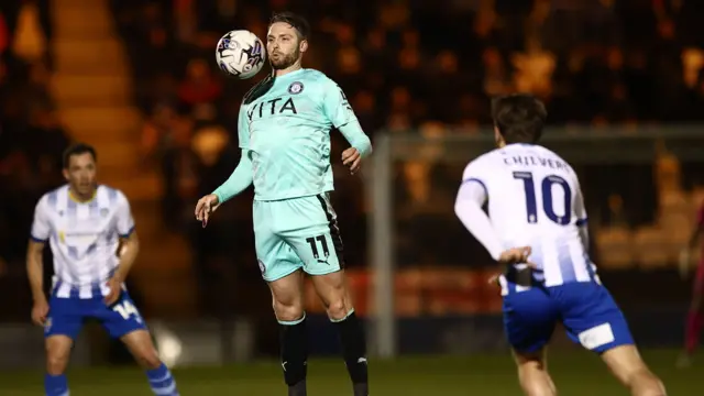 Nick Powell controls a ball on his chest