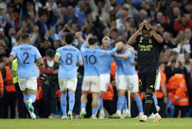 Rodrygo look dejected after Man City score