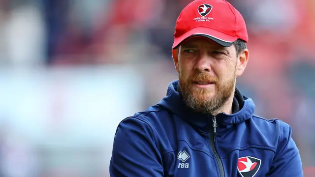 Darrell Clarke, Cheltenham manager, looks on from the touchline