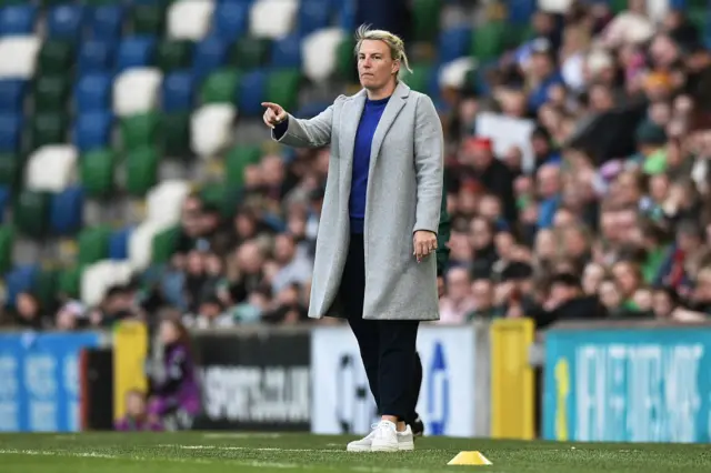 Tanya Oxtoby stands on the touchline