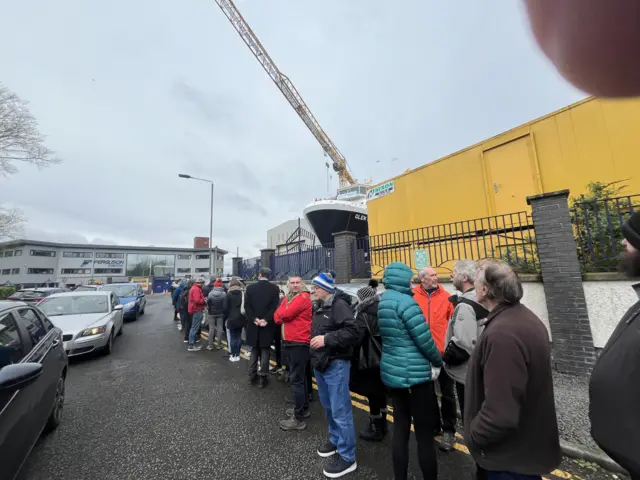 Line of people queue outside Ferguson Marine shipyard