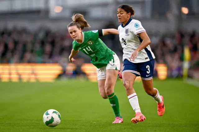 Jessica Carter of England in action against Heather Payne of the Republic of Ireland