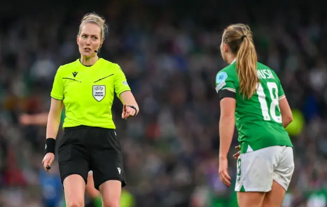 Referee Lina Lehtovaara with Ruesha Littlejohn of Republic of Ireland