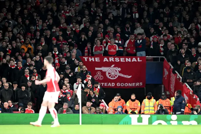 Arsenal fans cheer on the team