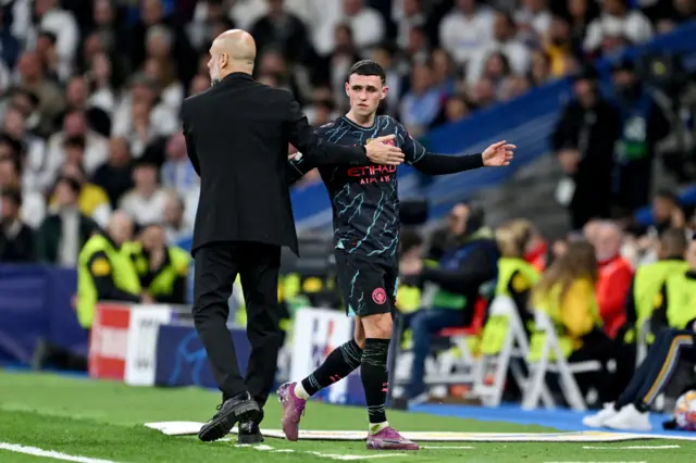 Foden comes off and high fives Guardiola