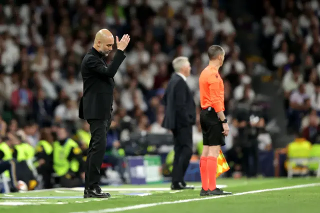 Guardiola gesticulates on the touchline