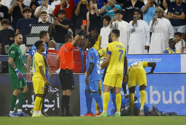 Cristiano Ronaldo is shown a red card