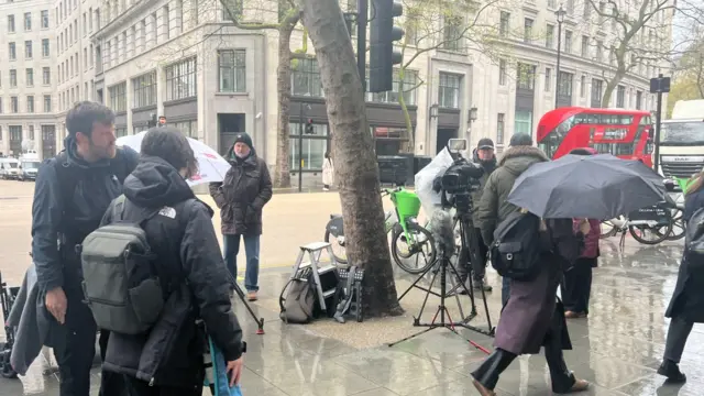 Camera crows wait outside Aldwych House