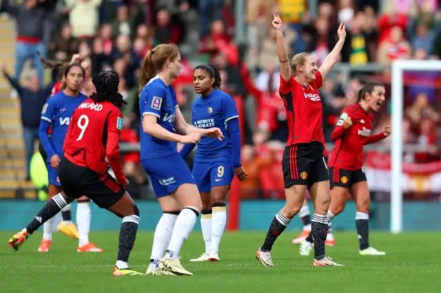 United players celebrate at the full time whistle