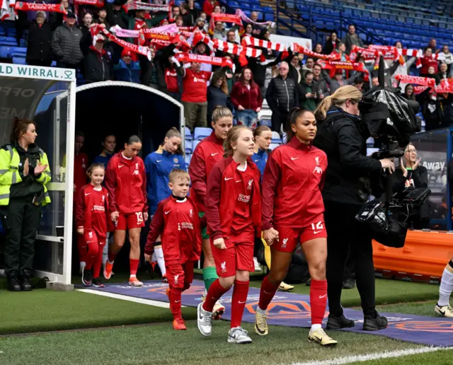 The teams walk out