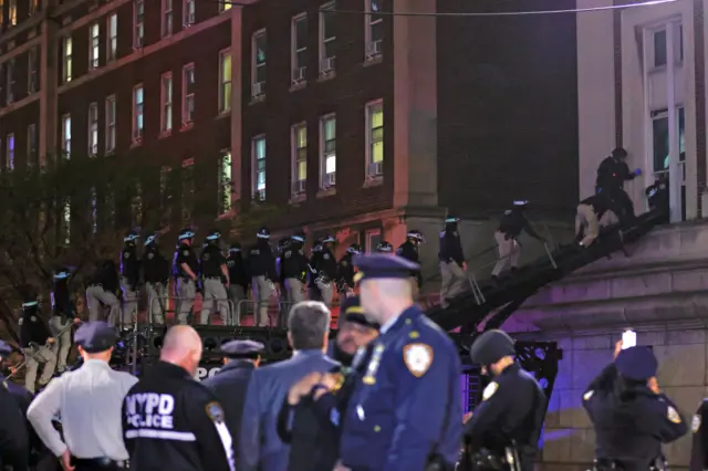 A line of police enter Hamilton Hall