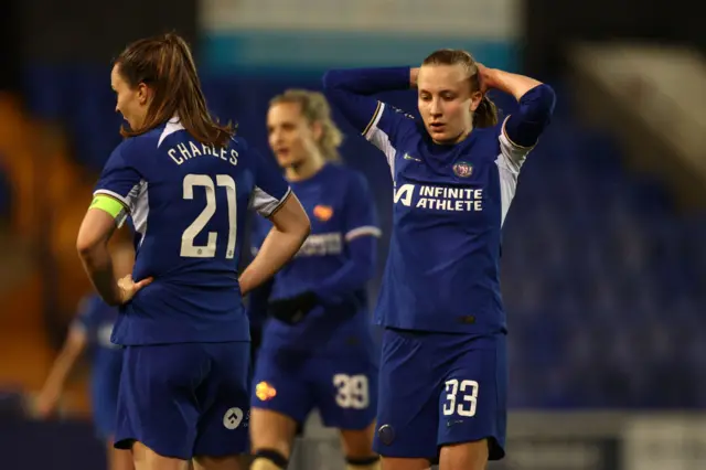 Aggie Beever-Jones puts her hands to her head in disbelief