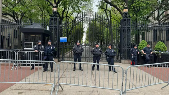 Police officers stand watch outside Columbia University