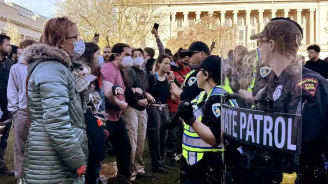 Police face off against pro-Palestinian supporters at an encampment on the Library Mall of the University of Wisconsin