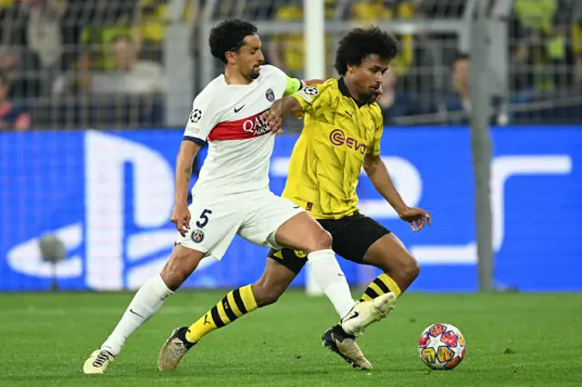 Marquinhos and Dortmund's German forward #27 Karim Adeyemi vie for the ball d