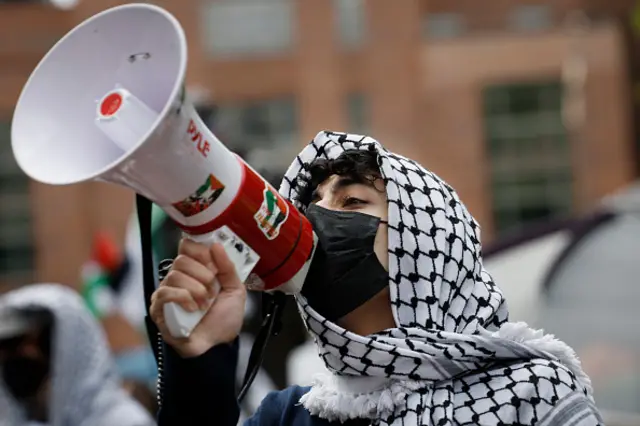 Activists and students protest on the outskirts of an encampment protest at the University Yard at George Washington University on 26 April 2024 in Washington, DC