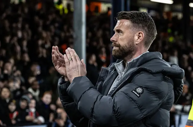 Luton Town's manager Rob Edwards applauds his side's supporters