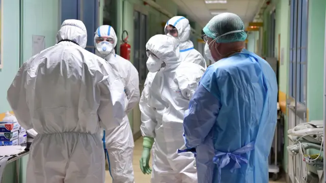 Doctors gathered in high PPE