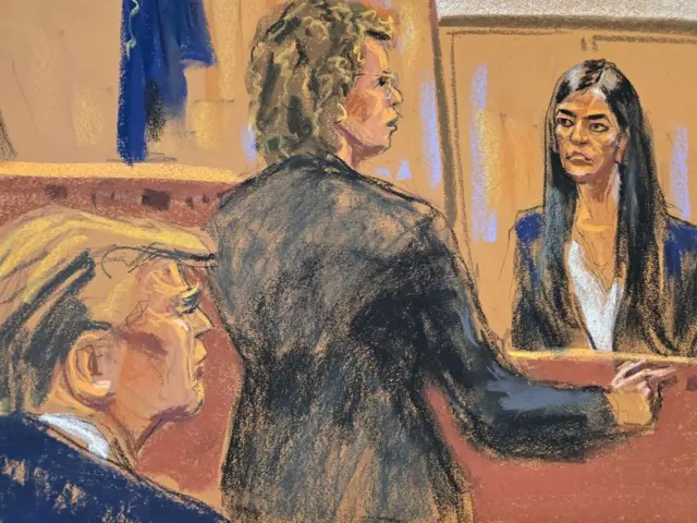 Donald Trump watches as former Director of Oval Office Operations Madeleine Westerhout is cross-examined by defense attorney Susan Necheles during Trump's criminal trial on charges that he falsified business records to conceal money paid to silence porn star Stormy Daniels in 2016, in Manhattan state court in New York City, U.S., May 10