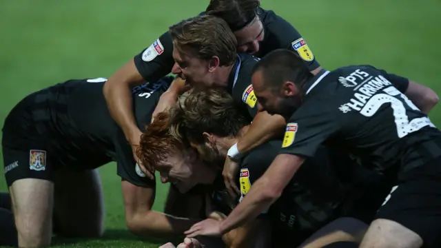 Northampton celebrate a goal against Cheltenham in 2020