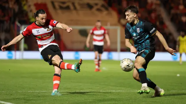 Jamie Sterry shoots for Doncaster Rovers