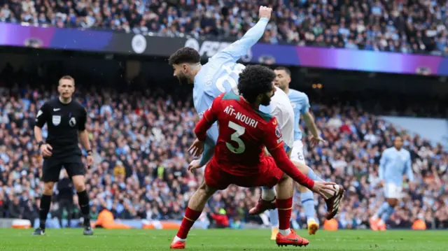 Josko Gvardiol of Manchester City is fouled by Rayan Ait-Nouri of Wolverhampton Wanderers