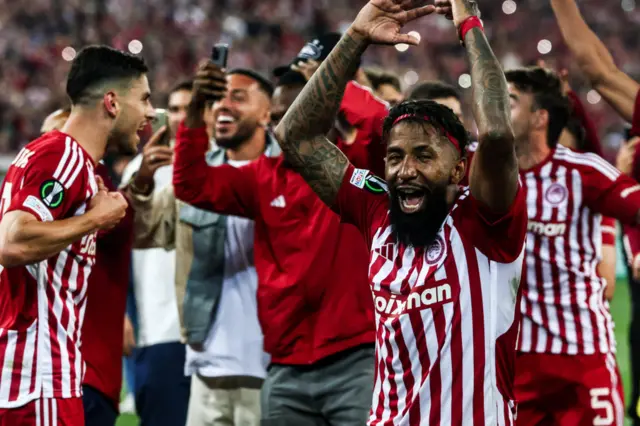 Olympiakos players celebrate beating Aston Villa