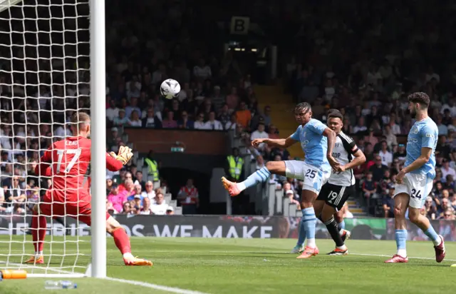 Manuel Akanji shoots and misses the chance to extend Manchester City's lead