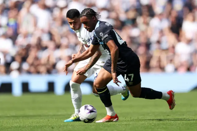 Wilson Odobert of Burnley runs with the ball under pressure from Pedro Porro of Tottenham Hotspur during the Premier League match between Tottenham Hotspur and Burnley FC