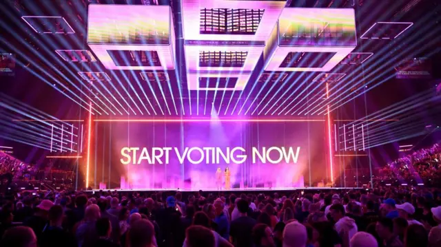 Start voting now sign is shown on stage at the Eurovision semi-finals