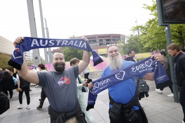 Fans hold Australian scarves