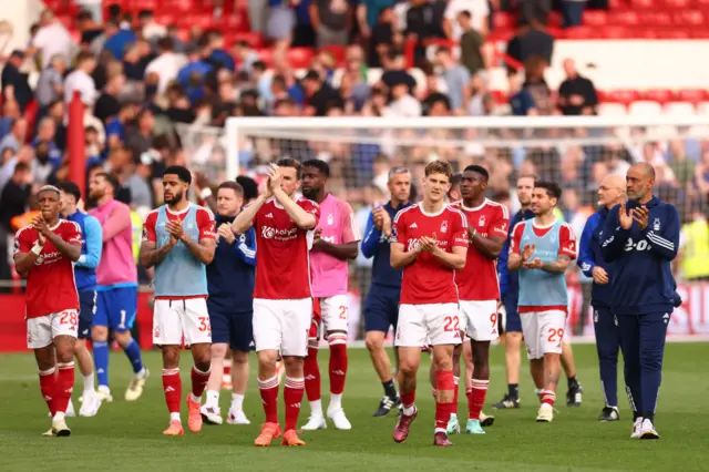 Players and staff of Nottingham Forest applaud the fans after the Premier League match between Nottingham Forest and Chelsea FC