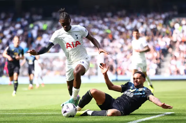 Yves Bissouma of Tottenham Hotspur is challenged by Vitinho of Burnley during the Premier League match between Tottenham Hotspur and Burnley FC