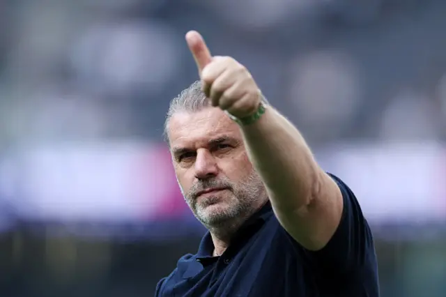 Ange Postecoglou, Manager of Tottenham Hotspur, gestures to the fans