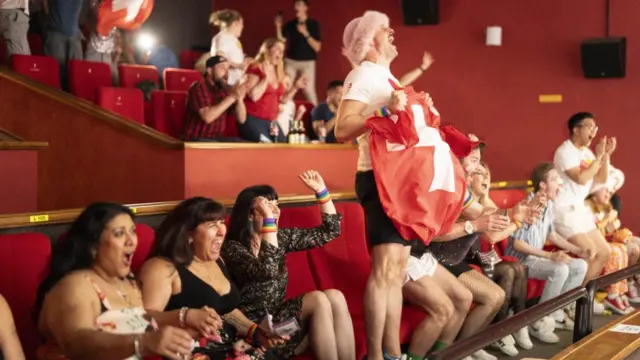 Fans inside the Malmo Arena in Sweden react to Nemo's win at Eurovision 2024