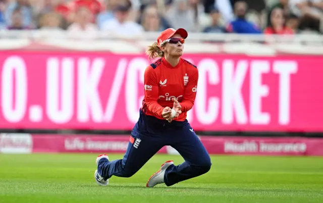 Danni Wyatt takes a catch to dismiss a Pakistan batter