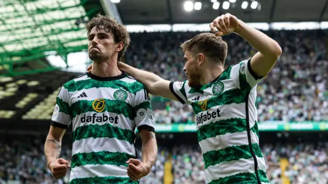 Celtic's Matt O'Riley celebrates with James Forrest after scoring to make it 1-0 during a cinch Premiership match between Celtic and Rangers at Celtic Park, on May 11, 2024, in Glasgow, Scotland.