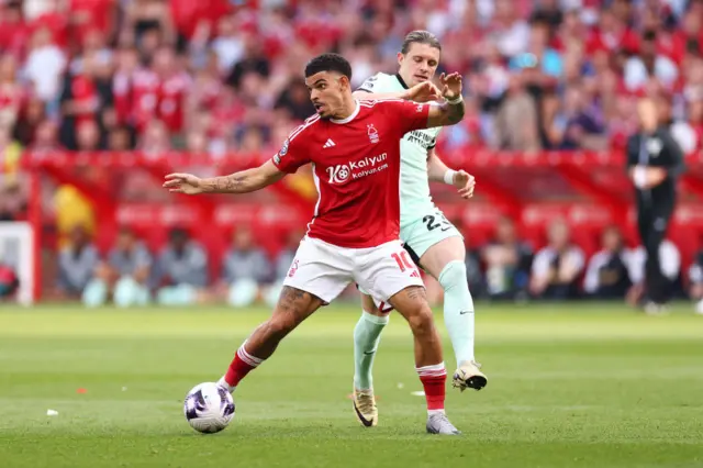 Morgan Gibbs-White of Nottingham Forest is challenged by Conor Gallagher of Chelsea during the Premier League match between Nottingham Forest and Chelsea FC