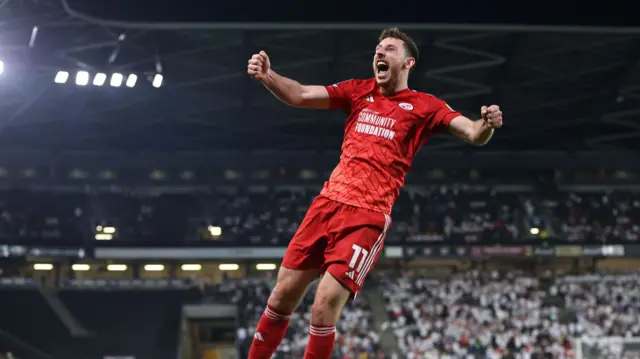 Crawley Town's Jack Roles celebrates scoring