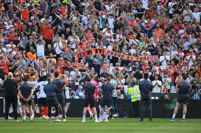 Players of Luton Town acknowledge the fans