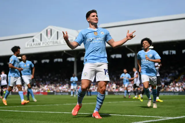 Manchester City's Julian Alvarez celebrates scoring his team's fourth goal