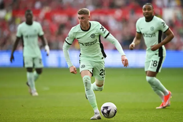 Cole Palmer runs with the ball during the English Premier League football match between Nottingham Forest and Chelsea