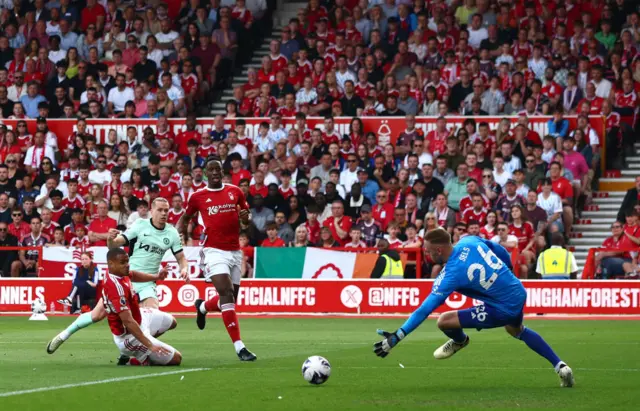 Mykhaylo Mudryk of Chelsea scores his team's first goal past Matz Sels of Nottingham Forest during the Premier League match between Nottingham Forest and Chelsea FC