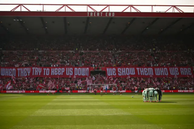 Forest fans display banners during the English Premier League football match between Nottingham Forest and Chelsea at The City Ground