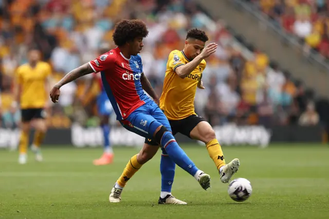 Chris Richards of Crystal Palace is challenged by Joao Gomes