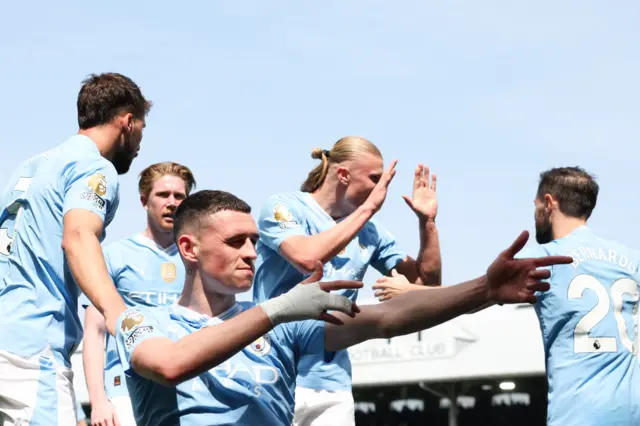 Manchester City's English midfielder Phil Foden celebrates scoring the team's second goal during the English Premier League football match between Fulham and Manchester City at Craven Cottage